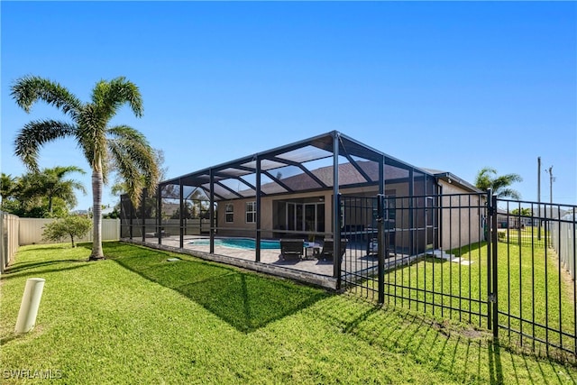 exterior space featuring a fenced in pool, a yard, a patio, a lanai, and a fenced backyard