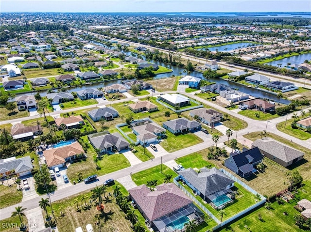 aerial view with a residential view and a water view