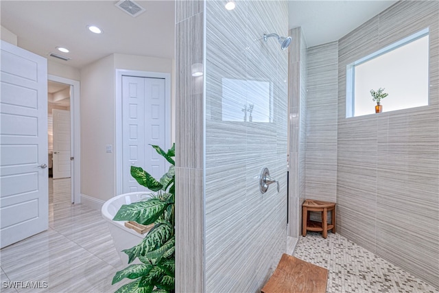 bathroom with visible vents, a walk in shower, a closet, and tile patterned floors