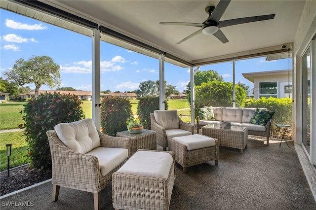 sunroom featuring a healthy amount of sunlight and ceiling fan