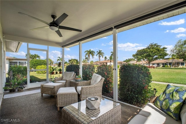 sunroom featuring a ceiling fan