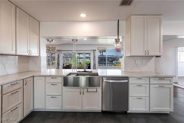 kitchen with decorative light fixtures, visible vents, white cabinetry, dishwasher, and a peninsula