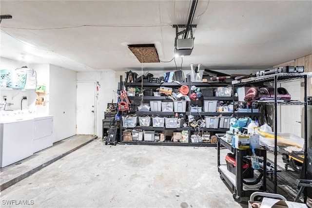 garage featuring separate washer and dryer and a garage door opener