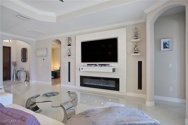 28074 Edenderry Ct, Bonita Springs, FL 34135 - living room featuring crown molding, tile patterned flooring, arched walkways, a glass covered fireplace, and baseboards