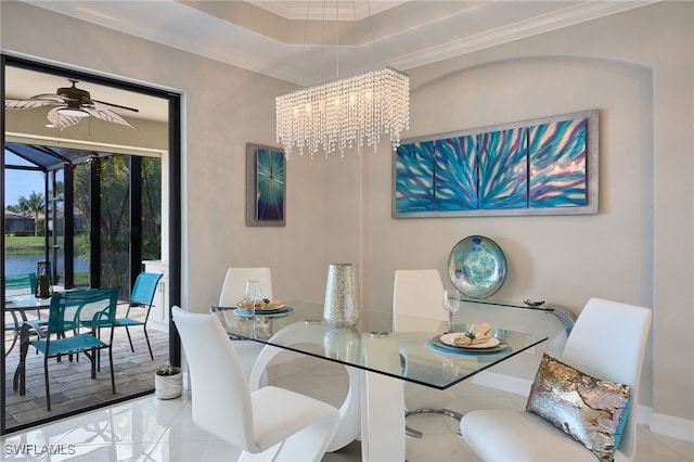 28074 Edenderry Ct, Bonita Springs, FL 34135 - tiled dining area with ornamental molding, a chandelier, baseboards, and a raised ceiling