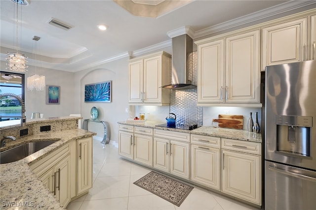 28074 Edenderry Ct, Bonita Springs, FL 34135 - kitchen with stainless steel fridge, cream cabinets, wall chimney exhaust hood, a sink, and crown molding