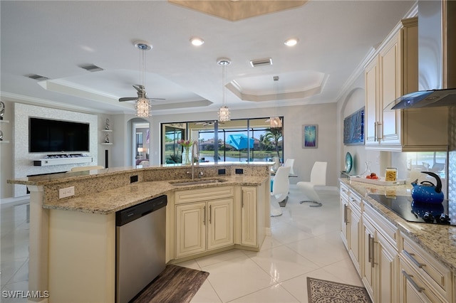 28074 Edenderry Ct, Bonita Springs, FL 34135 - kitchen featuring stainless steel dishwasher, cream cabinetry, a sink, wall chimney exhaust hood, and a tray ceiling