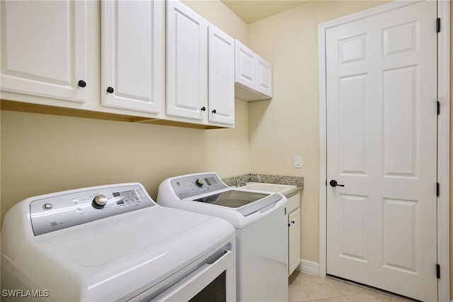 28074 Edenderry Ct, Bonita Springs, FL 34135 - laundry room with washer and dryer, cabinet space, and light tile patterned flooring