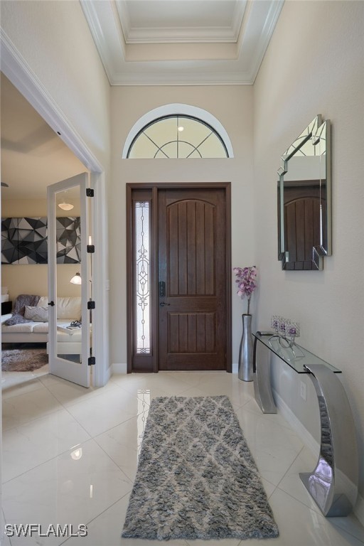 28074 Edenderry Ct, Bonita Springs, FL 34135 - foyer entrance with ornamental molding and baseboards