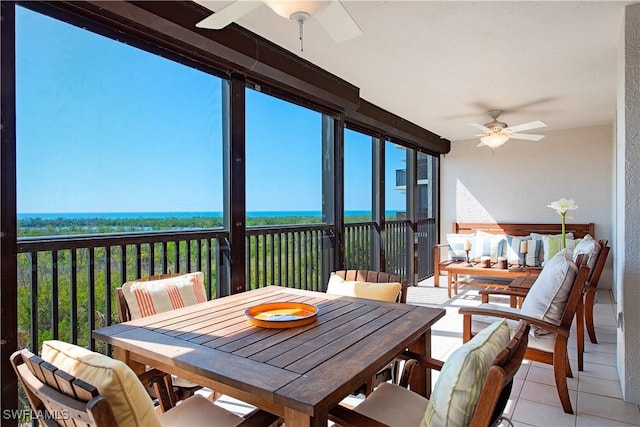 sunroom with a ceiling fan