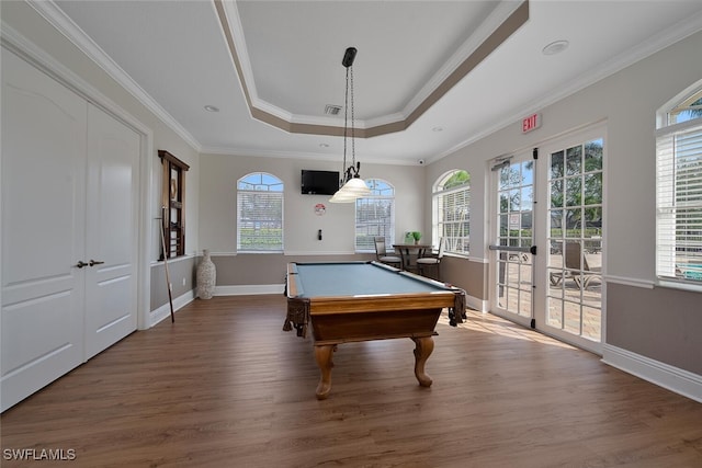 game room with ornamental molding, a tray ceiling, french doors, and wood finished floors