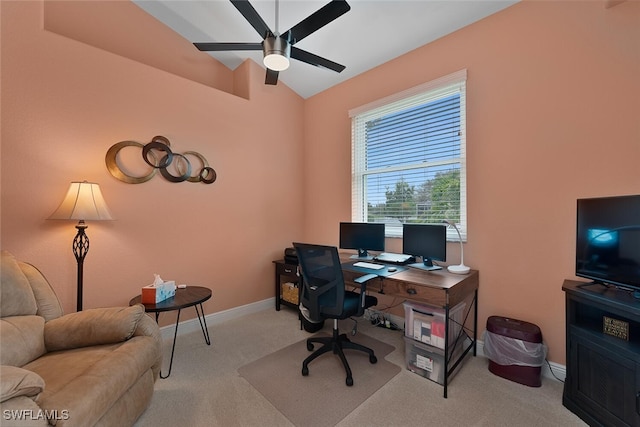 office space featuring carpet floors, lofted ceiling, baseboards, and a ceiling fan