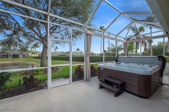 unfurnished sunroom featuring a hot tub