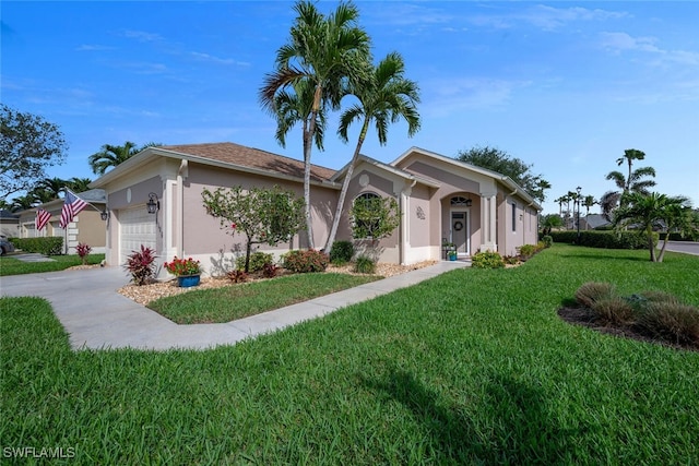 ranch-style home featuring concrete driveway, a front yard, an attached garage, and stucco siding