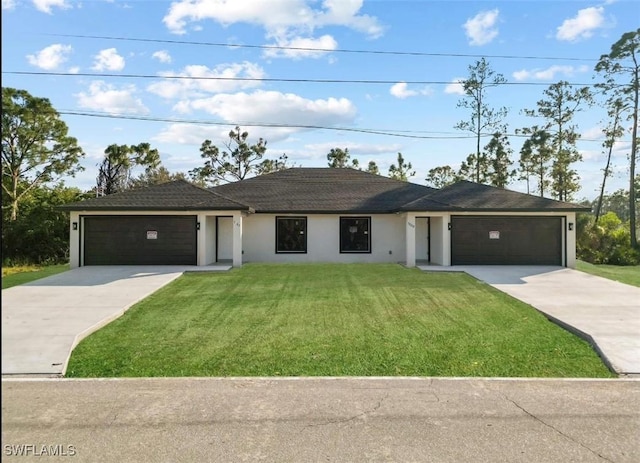 ranch-style house featuring a garage, concrete driveway, and a front lawn