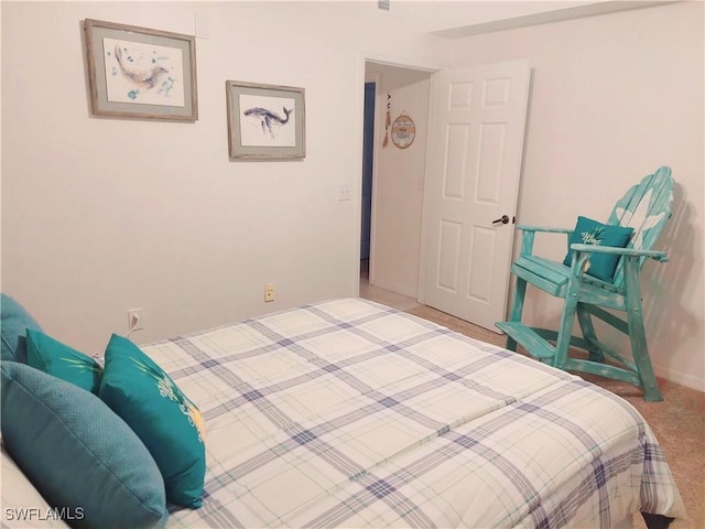 carpeted bedroom with baseboards