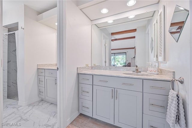 4145 Prestwick Ct, North Fort Myers, FL 33903 - full bathroom with beam ceiling, marble finish floor, vanity, and baseboards
