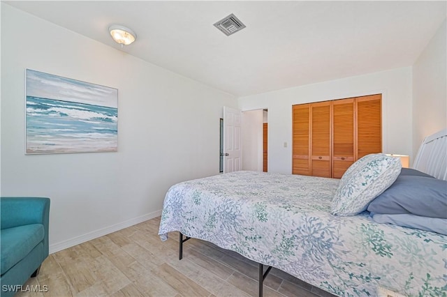 4145 Prestwick Ct, North Fort Myers, FL 33903 - bedroom featuring a closet, visible vents, baseboards, and wood finished floors