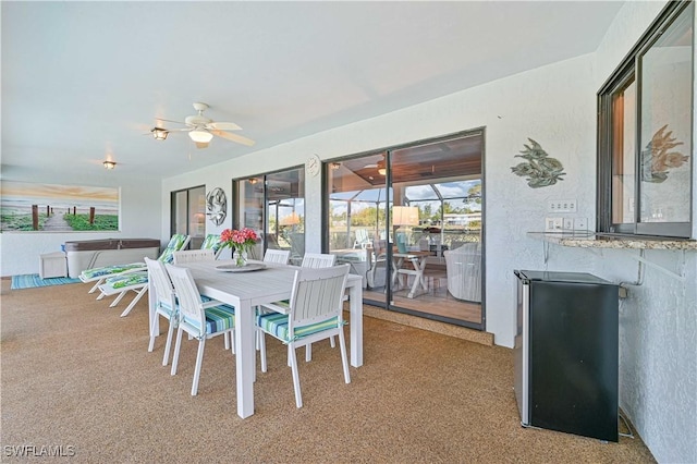4145 Prestwick Ct, North Fort Myers, FL 33903 - dining area with a sunroom, light carpet, and ceiling fan