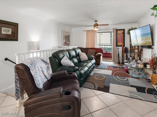 living area with light tile patterned floors, baseboards, ornamental molding, and a ceiling fan