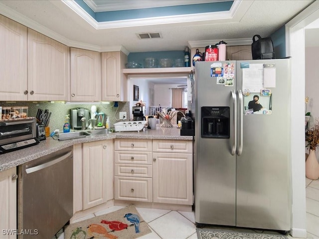 kitchen with light tile patterned floors, visible vents, stainless steel appliances, and light countertops