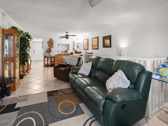 living room featuring light tile patterned floors and ornamental molding