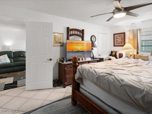 bedroom featuring light tile patterned floors and ceiling fan