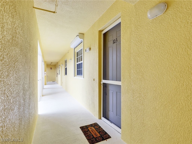 view of exterior entry with stucco siding