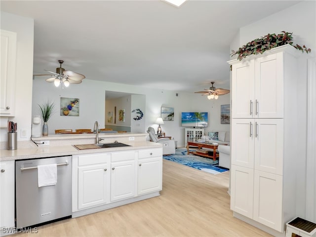 kitchen featuring stainless steel dishwasher, a peninsula, a sink, and ceiling fan