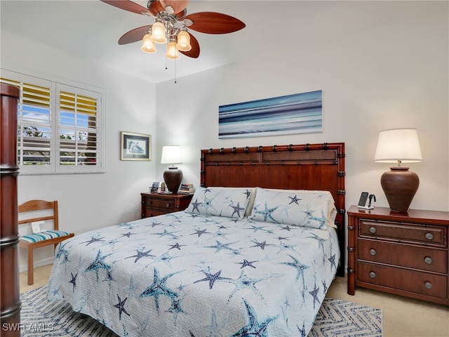 bedroom featuring a ceiling fan and light colored carpet