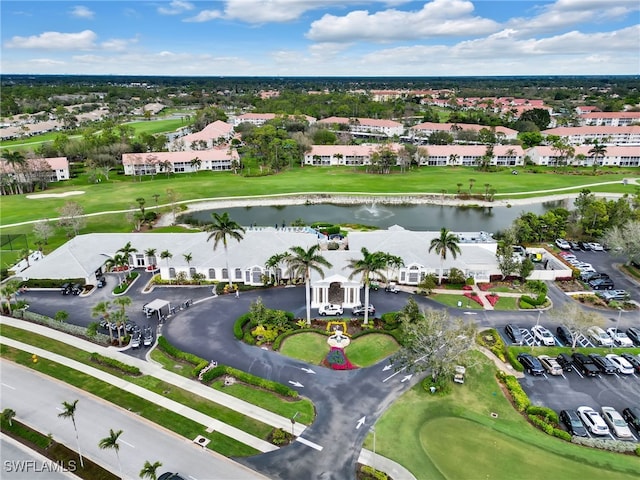 birds eye view of property with a residential view, golf course view, and a water view