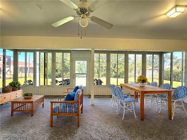 sunroom with a ceiling fan