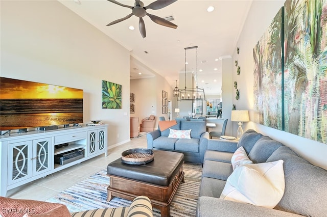 living room with light tile patterned floors, recessed lighting, visible vents, and ceiling fan with notable chandelier