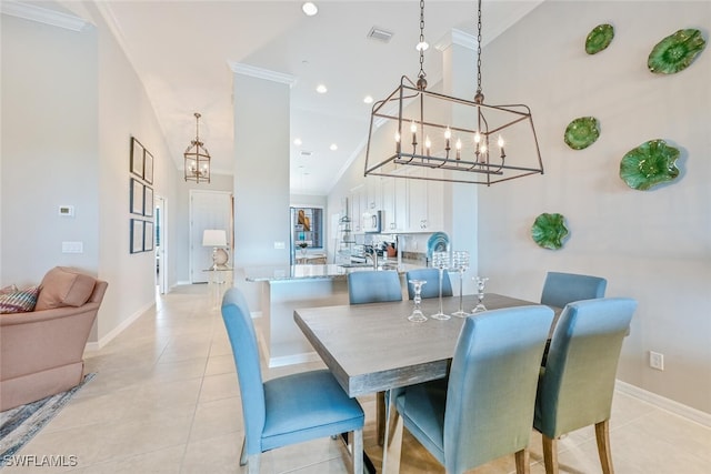 dining space featuring light tile patterned floors, high vaulted ceiling, ornamental molding, and visible vents