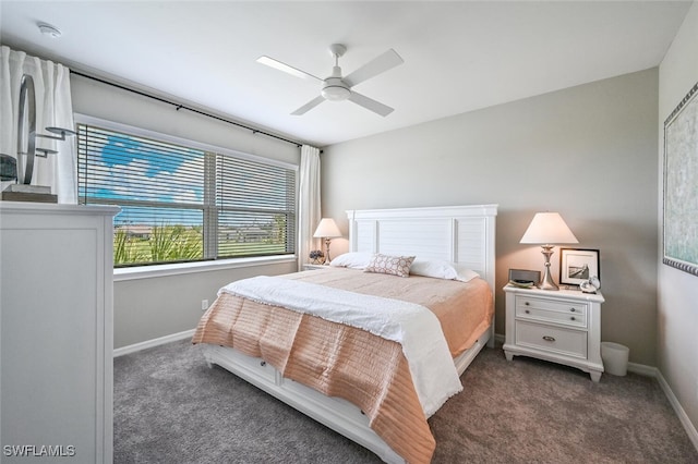 bedroom with ceiling fan, baseboards, and dark colored carpet