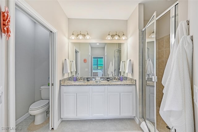 full bath with double vanity, toilet, ensuite bathroom, a shower stall, and tile patterned floors