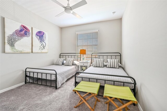 bedroom with carpet floors, ceiling fan, and baseboards