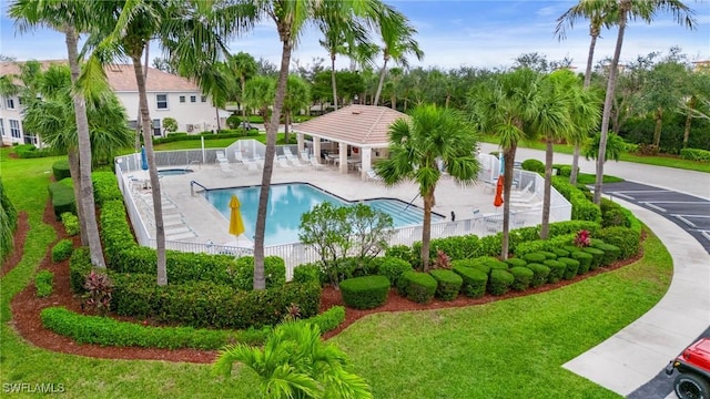 community pool featuring a yard, a gazebo, fence, and a patio