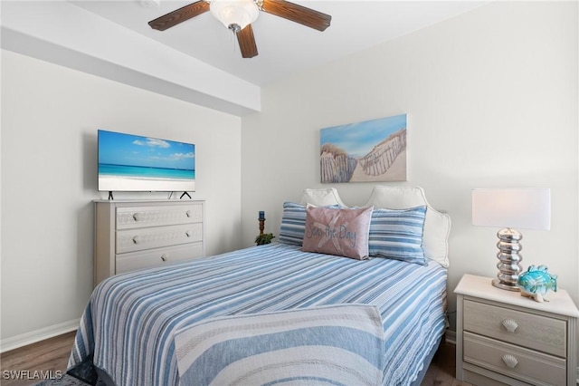 bedroom with dark wood-type flooring, baseboards, and a ceiling fan