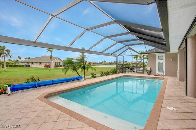 pool with a patio, a lawn, and a lanai