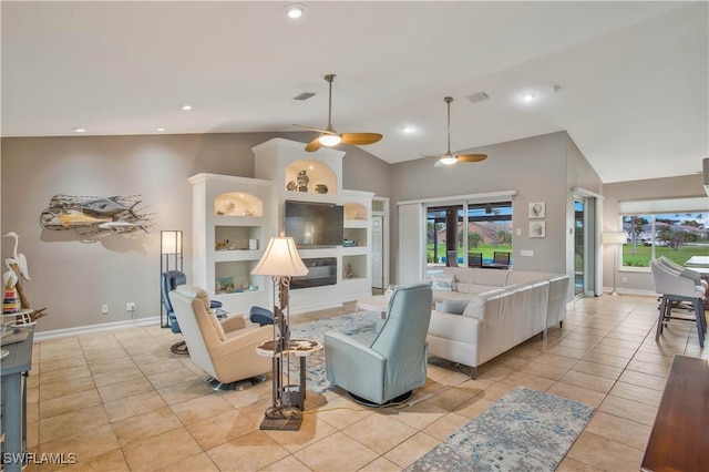 living room with a healthy amount of sunlight, ceiling fan, light tile patterned flooring, and lofted ceiling