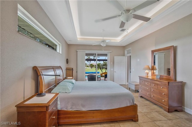 bedroom with light tile patterned floors, baseboards, ceiling fan, access to exterior, and a tray ceiling