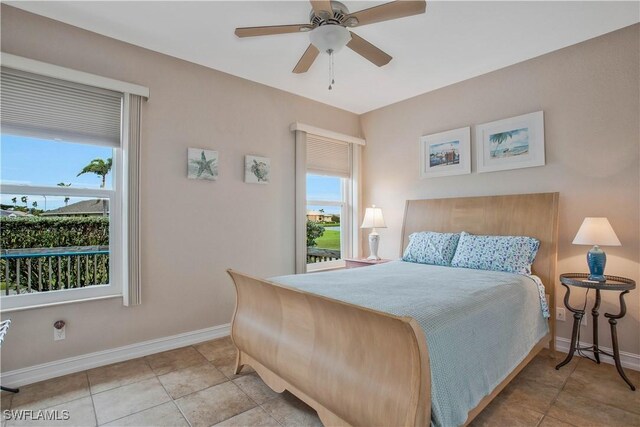 bedroom featuring a ceiling fan, baseboards, and light tile patterned floors