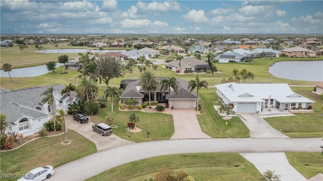 bird's eye view featuring a water view and a residential view