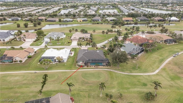 drone / aerial view featuring a water view and a residential view