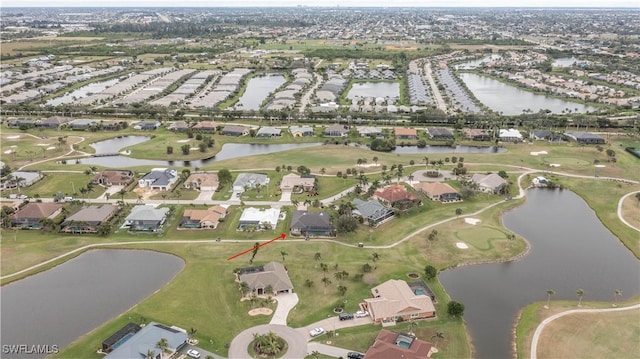 bird's eye view with a residential view and a water view