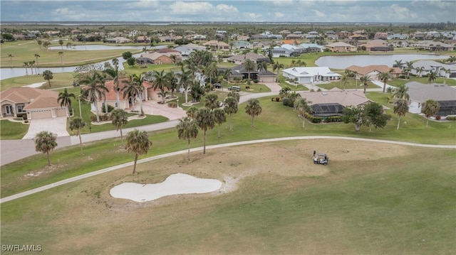 bird's eye view featuring a water view and a residential view