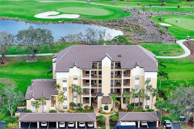 birds eye view of property featuring a water view and golf course view