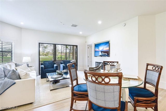 dining room with recessed lighting, visible vents, and light wood-style floors