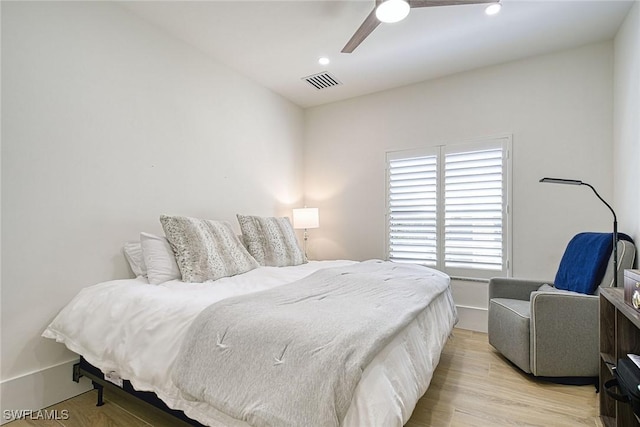 bedroom featuring a ceiling fan, recessed lighting, visible vents, and light wood-style floors